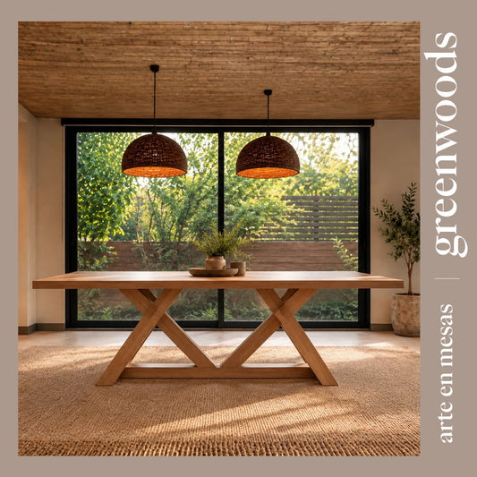 Mesa de comedor Italia de madera lenga con base en X, frente a un ventanal al jardín y lámparas de mimbre | Greenwoods Chile